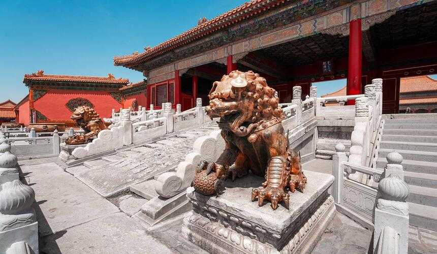 The Gate of Heavenly Purity in the Forbidden City with red pillars, gold accents, and a traditional Chinese palace entrance.