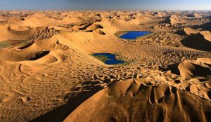Towering sand dunes and desert lakes in the Badain Jaran Desert of Inner Mongolia