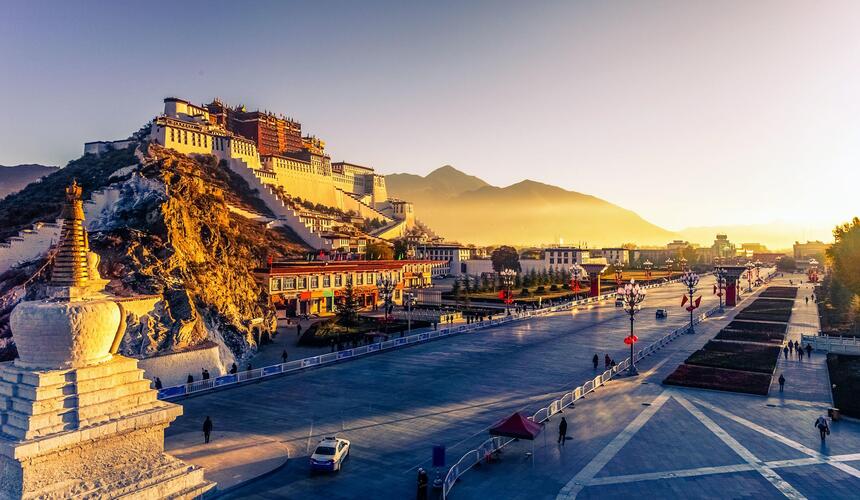 Tibetan plateau landscape with snow-capped Himalayan mountains, prayer flags, and high-altitude scenery in Tibet
