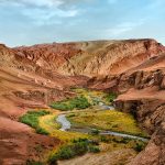 Traveler exploring the diverse landscapes and cultural attractions of Xinjiang travel destinations in western China