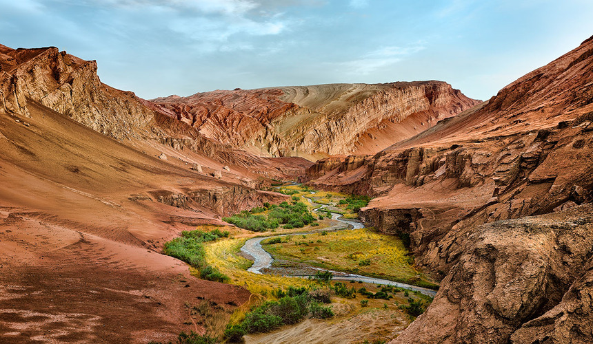 Traveler exploring the diverse landscapes and cultural attractions of Xinjiang travel destinations in western China