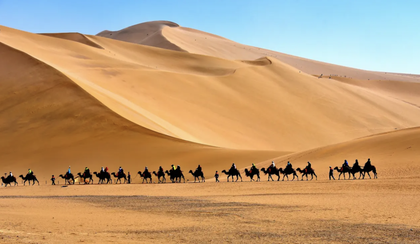 Travelers discovering ancient cities, deserts, and cultural treasures during Xinjiang’s Silk Road travel experience