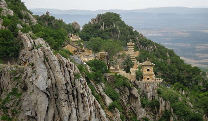 Scenic view of Mount Song, China, home to the renowned Shaolin Temple and rugged mountain peaks.