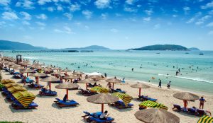 Golden sandy beach and turquoise waters in Sanya, Hainan Province, China