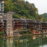 Ancient towns in China featuring traditional architecture, stone streets, and historic waterways.