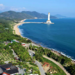 A tropical view of Sanya with beaches, palm trees, and luxury resorts on Hainan Island, China