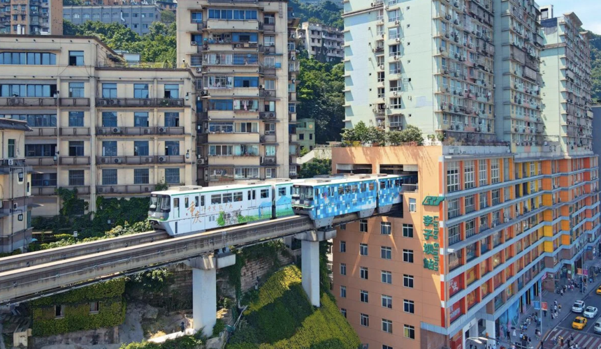 Chongqing monorail passing through the residential building at Liziba Monorail Station.