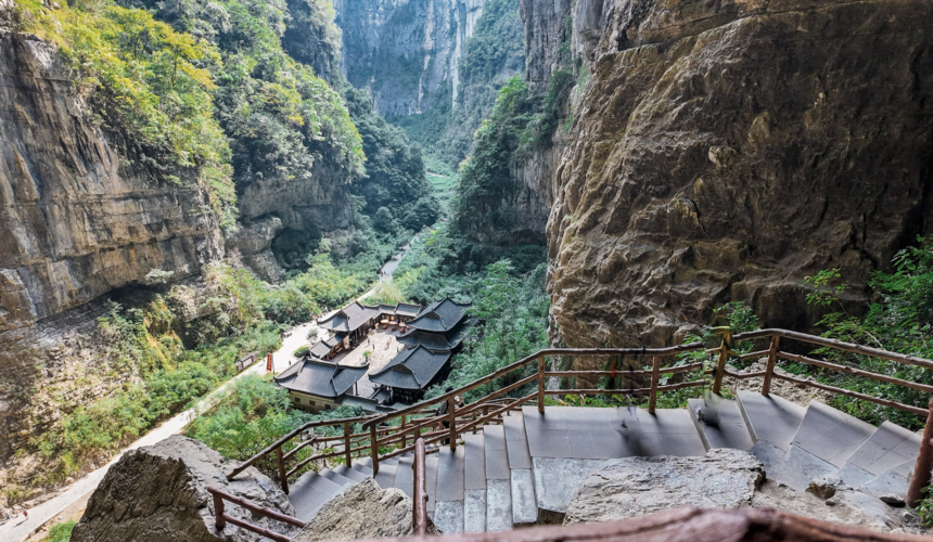 Spectacular limestone bridges, caves, and dramatic cliffs in Wulong Karst National Geology Park.